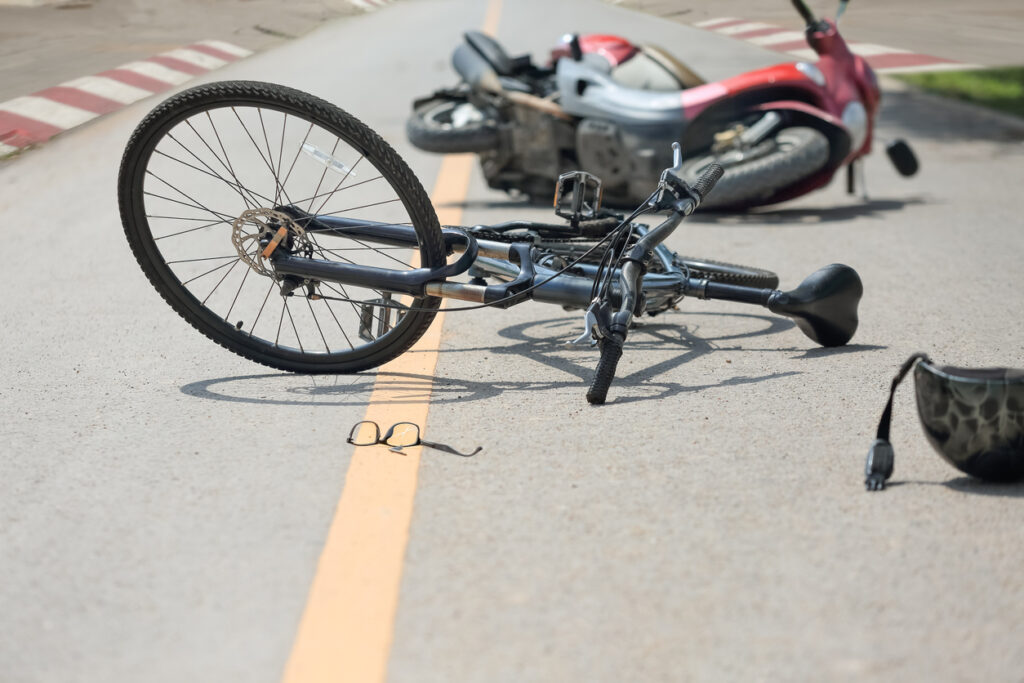 Motorcycle and bicycle accident scene for fault determination in collisions